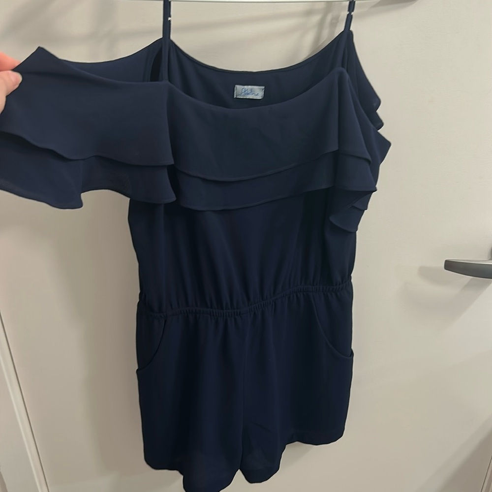 Beautiful navy romper with off the shoulder sleeve